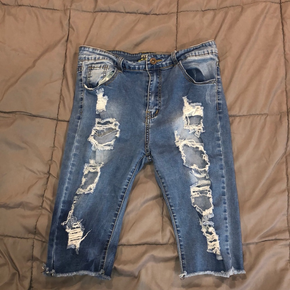 Ripped jeans above the knee